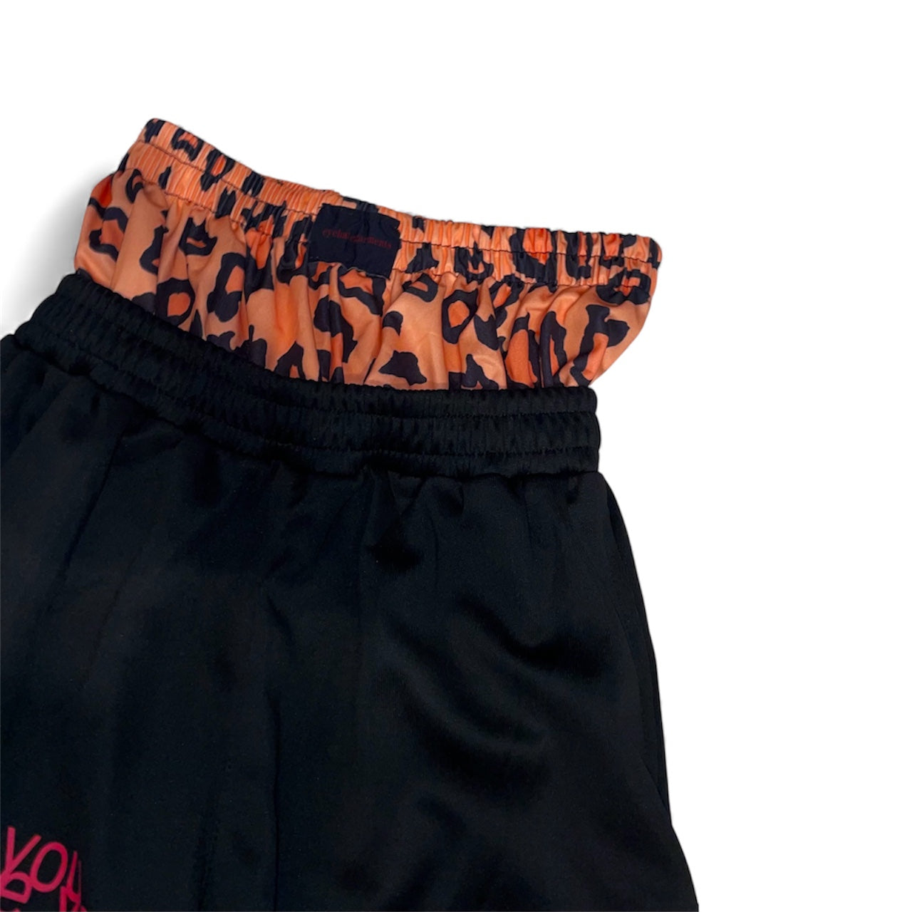 Pantalon jogging large à motifs avec short intégré léopard